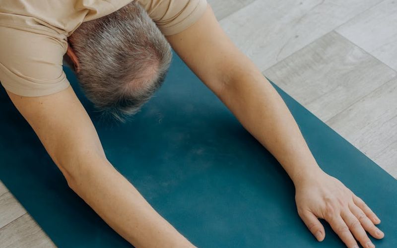 Man focusing before an exercise, calm atmosphere.